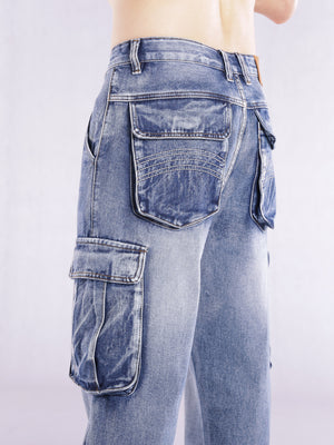 Relaxed fit light wash denim cargo jeans with flap pockets and contrast stitching.