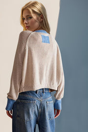 Caramel raglan sleeve cardigan with blue contrast trim and patch detail