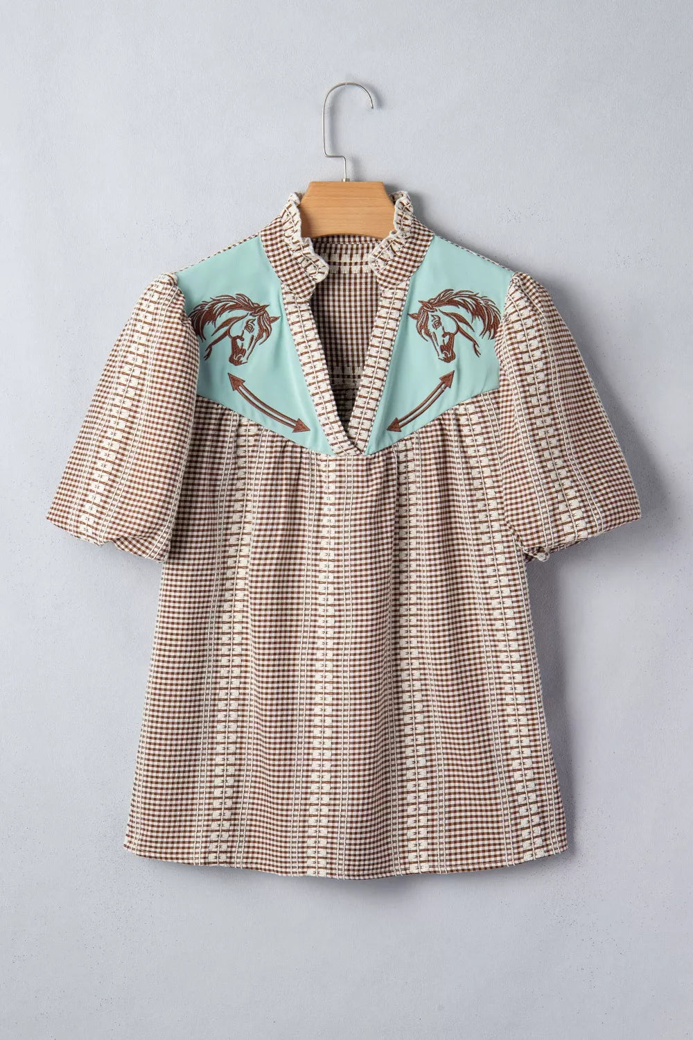 Brown gingham maternity shirt with embroidered horse yoke and puff sleeves.
