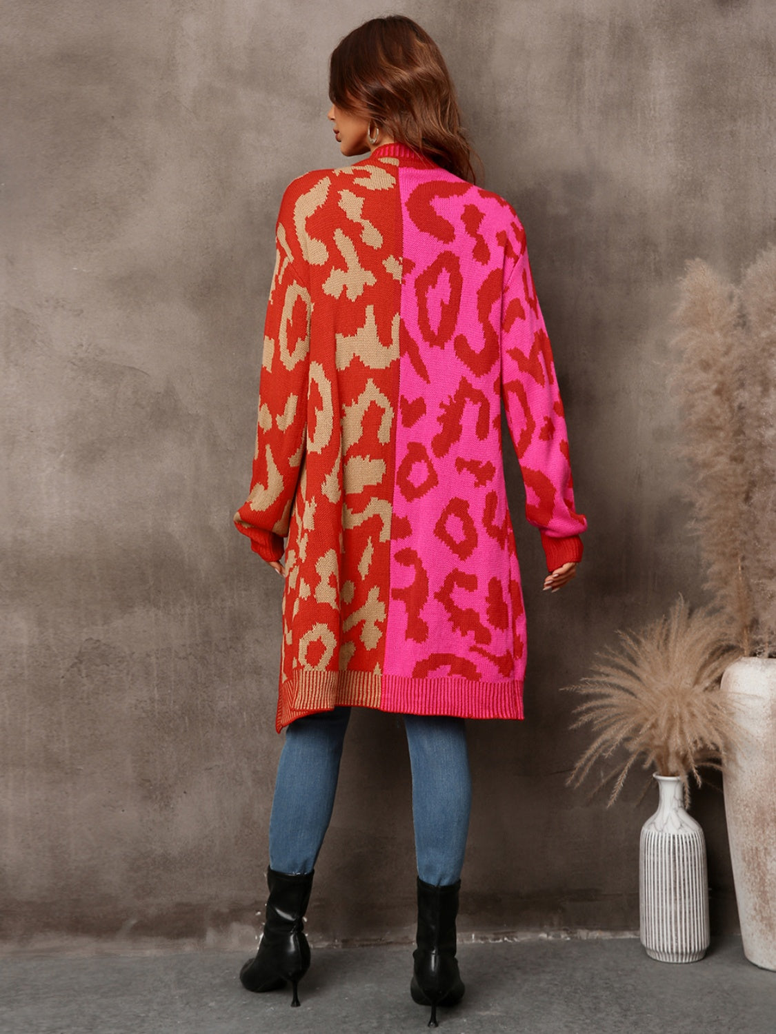 Colorblock leopard knit duster cardigan in red and pink with tan accents.