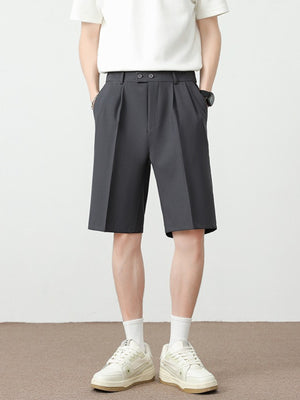 Men's dark gray pleated detail loose-fit chino shorts with a double button closure.