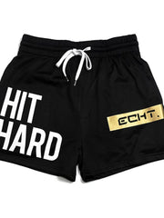 Black mesh training shorts with white "HIT HARD" graphic and gold "ECHT." logo patch.