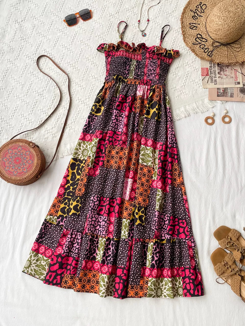 Frilled smocked leopard maxi dress with abstract patchwork print and tiered skirt.