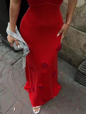 Deep red cami gown with embroidered rose appliqués and a backless design.