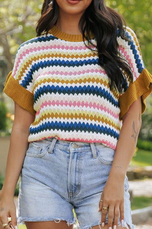 Textured stripe knit sweater with mustard trim and short sleeves, styled with denim shorts.