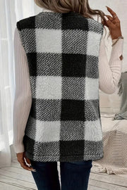 Oversized sherpa gilet in black and white buffalo check with a fuzzy texture.