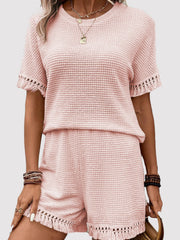 Blush pink waffle knit outfit set with fringe trim on short sleeves and shorts.