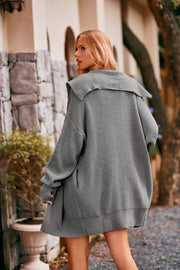 Oversized hooded knit cardigan in Heather Gray with a wide collar and pockets.