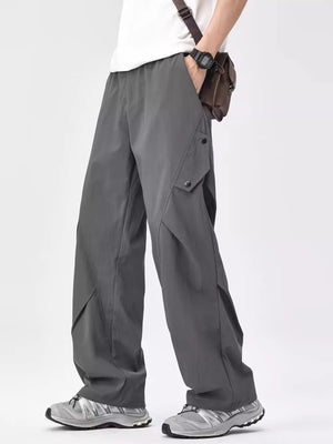 Relaxed fit grey cargo sweatpants with snap pockets and wide leg.