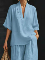 Sky blue half-sleeve top with V-neck and wide-leg pants set.