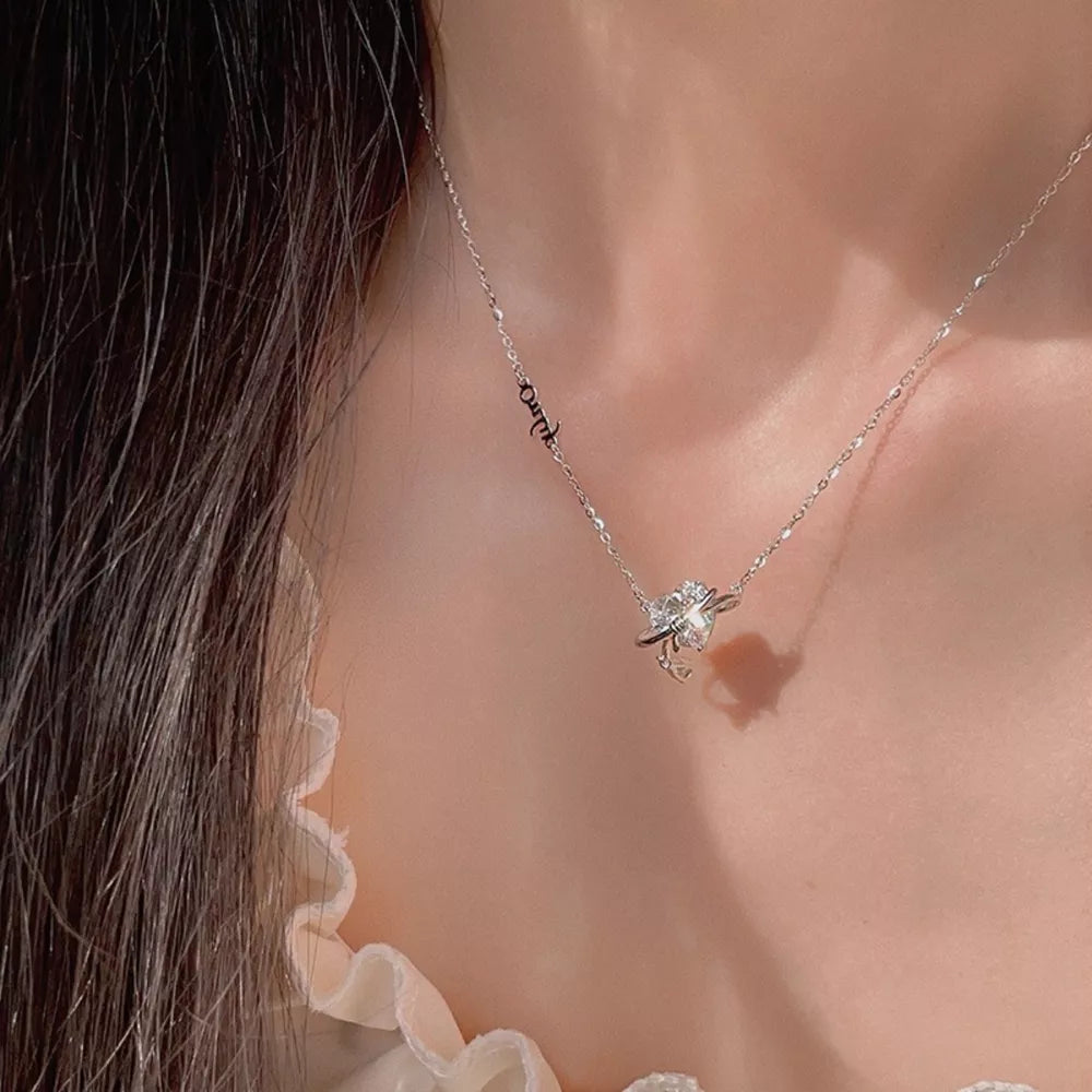 Elegant silver necklace with a sparkling zircon heart pendant and delicate chain.