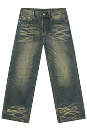 Distressed denim wide-leg trousers in medium wash with artisanal fading and whiskering details.