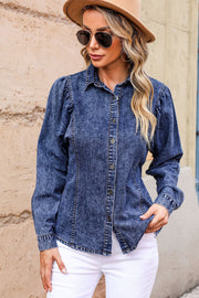 Acid wash denim shirt with puff sleeves, button front, and collared neckline.