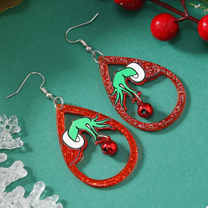 Acrylic teardrop earrings with Grinch hands holding red bells, glitter red outline