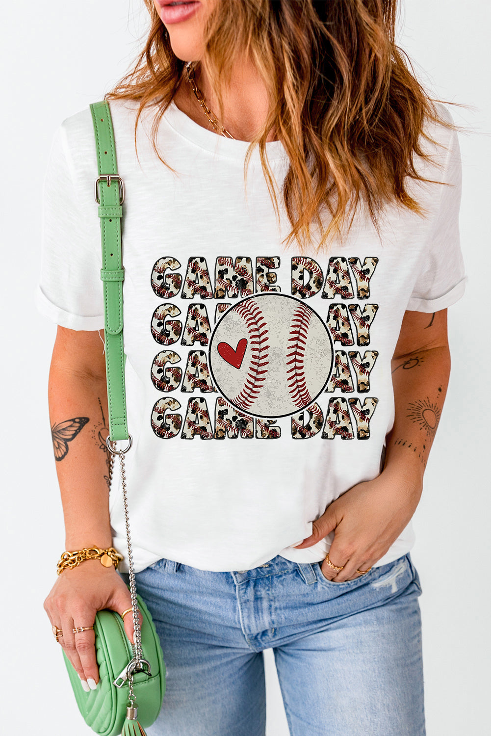 White baseball graphic tee with "Game Day" text and a baseball with a heart.