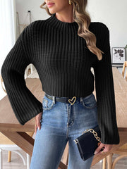 Black ribbed crop sweater with mock neck and bell sleeves.