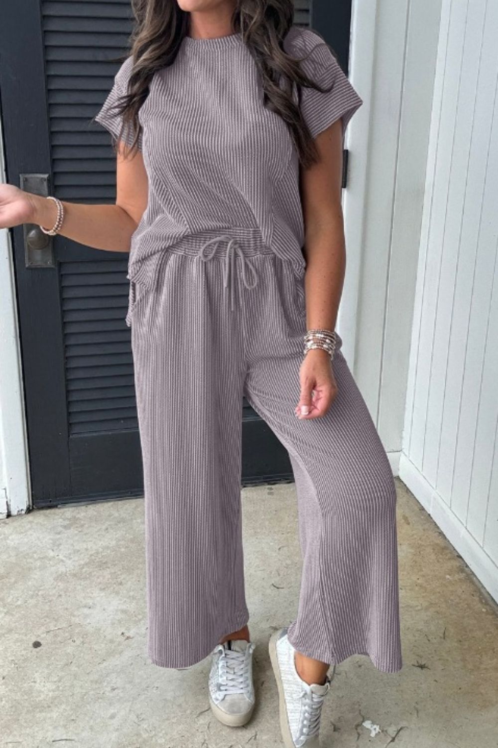 Gray ribbed knit drawstring co-ord set with short sleeves and wide-leg pants.