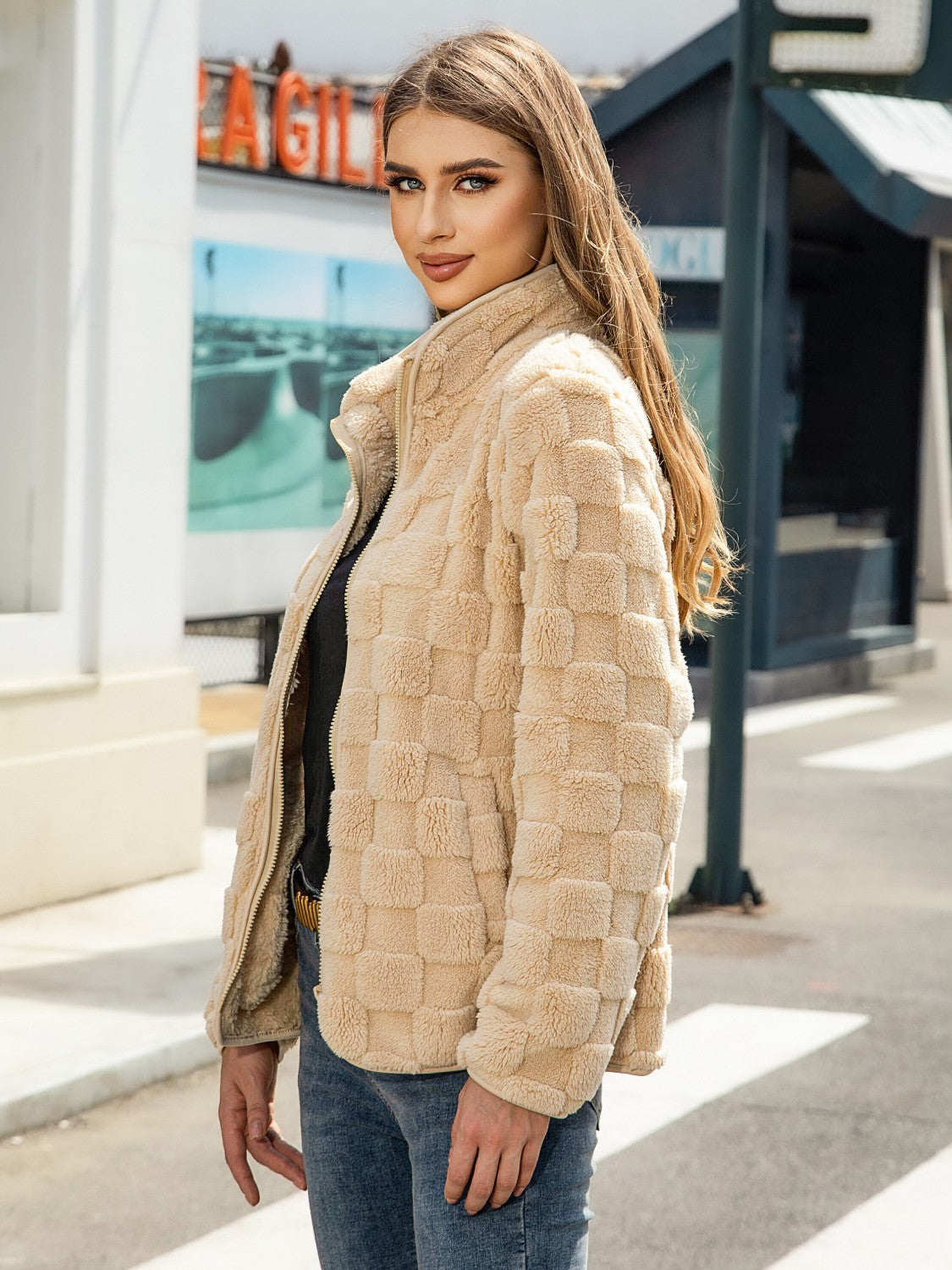 Tan textured grid zip-up jacket with a stand-up collar.