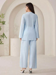 Light blue crinkled texture two-piece set with wide-leg pants and long-sleeve top.
