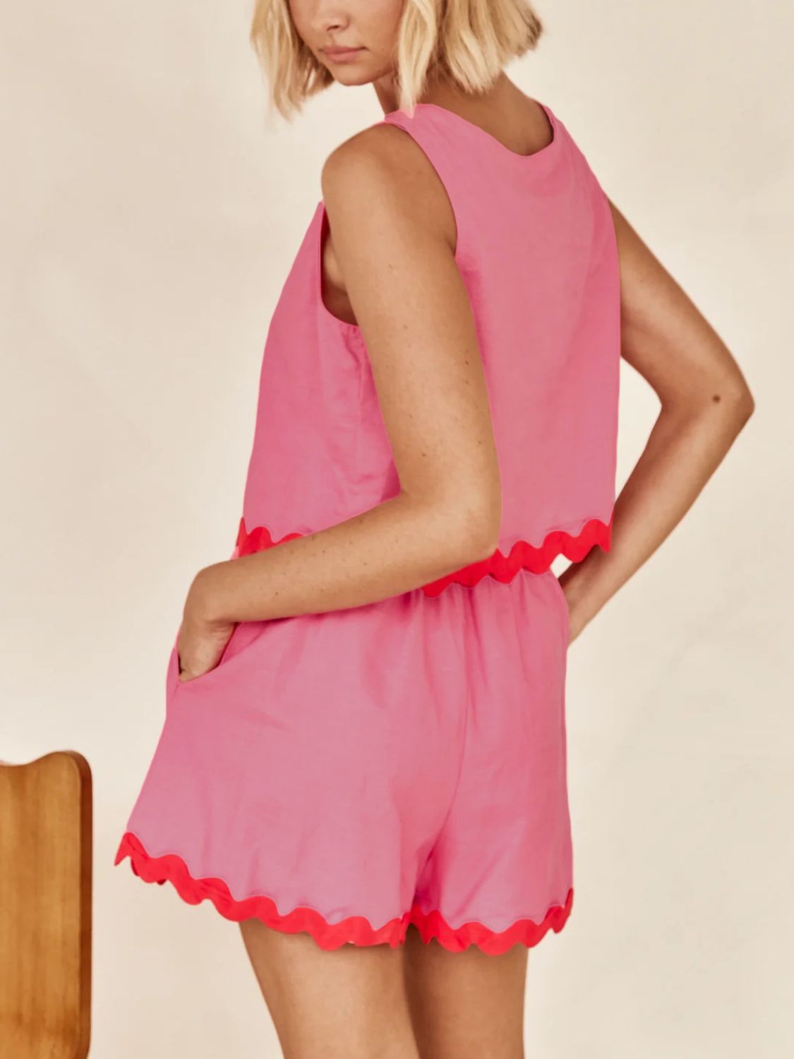 Scalloped edge tank and shorts set in fuchsia pink with contrasting red trim.