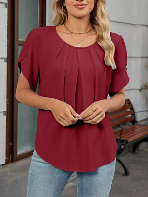 Wine red pleated short sleeve polyester blouse with round neckline.