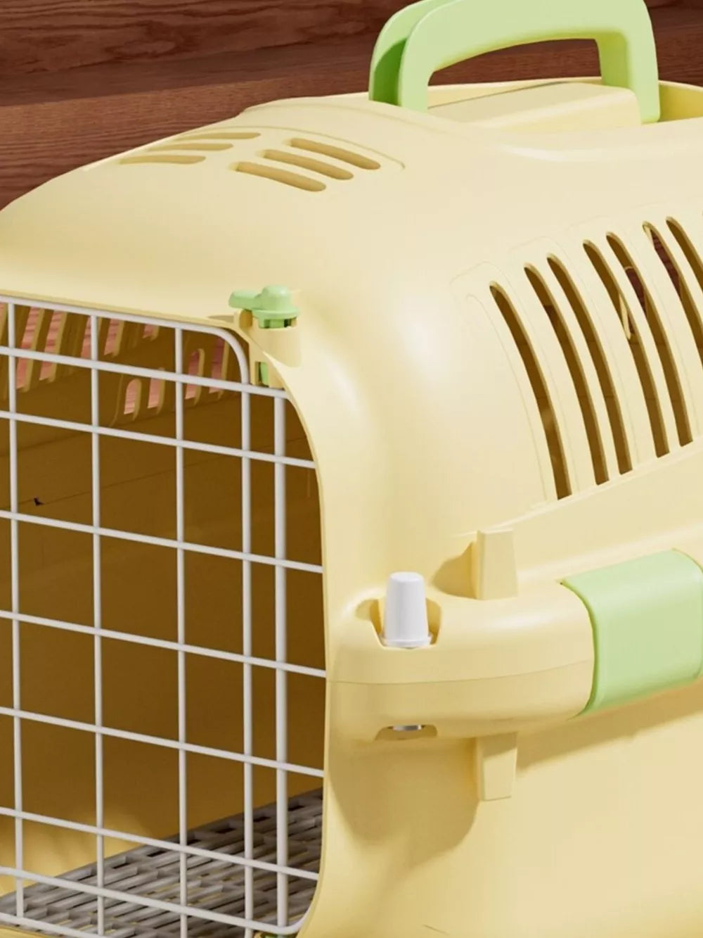 Cheerful ventilated pet carrier bag in pastel yellow with green accents and a white wire door.