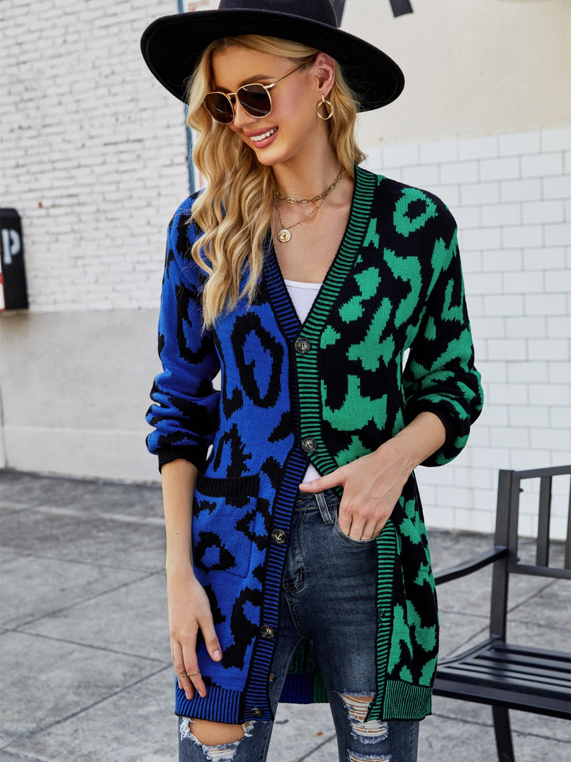 Colorblock leopard knit duster cardigan with button front and pockets.
