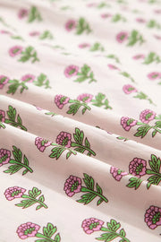Floral V-neck midi dress in blush pink with a charming pink floral print and green leaves.