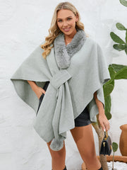 Gray faux fur collar wrap poncho with tie detail and pom-pom accent.