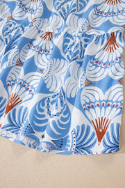 Botanic print ruffled dress with flutter sleeves and tiered hem in blue and white.