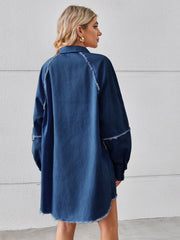 Dark blue denim shirt dress with raw hem detail and button front, shown from the back.