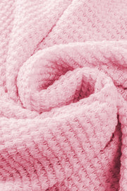 Blush pink waffle knit button-down shirt jacket detail showing texture.