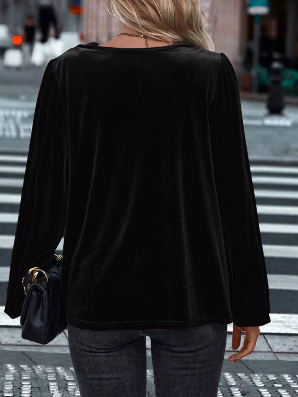 Black velvet cowl neck shirt with long sleeves and a relaxed fit.