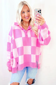 Fuchsia pink checkered knit sweater with polo neckline and button detail