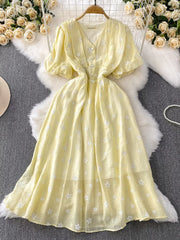 Yellow embroidered puff sleeve midi dress with button front and V-neck