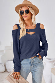 Dark blue long sleeve top with cutout shoulders and neckline detail.