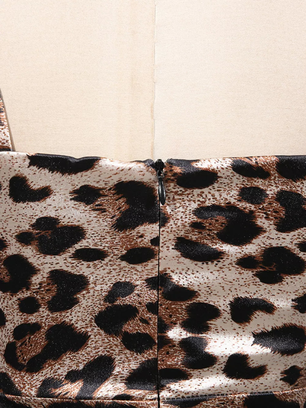 Chic leopard print bodycon midi dress with a back zipper detail.