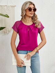 Hot pink polyester blouse with lace short sleeves and keyhole neckline.