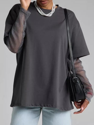 Dark gray oversized tee with sheer sparkly sleeves and a crew neck.