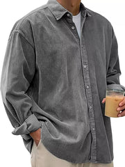 Men's gray corduroy button-up shirt with classic collar and long sleeves.