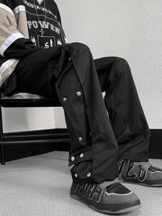 Men's black snap button loose fit sweatpants with adjustable waist.