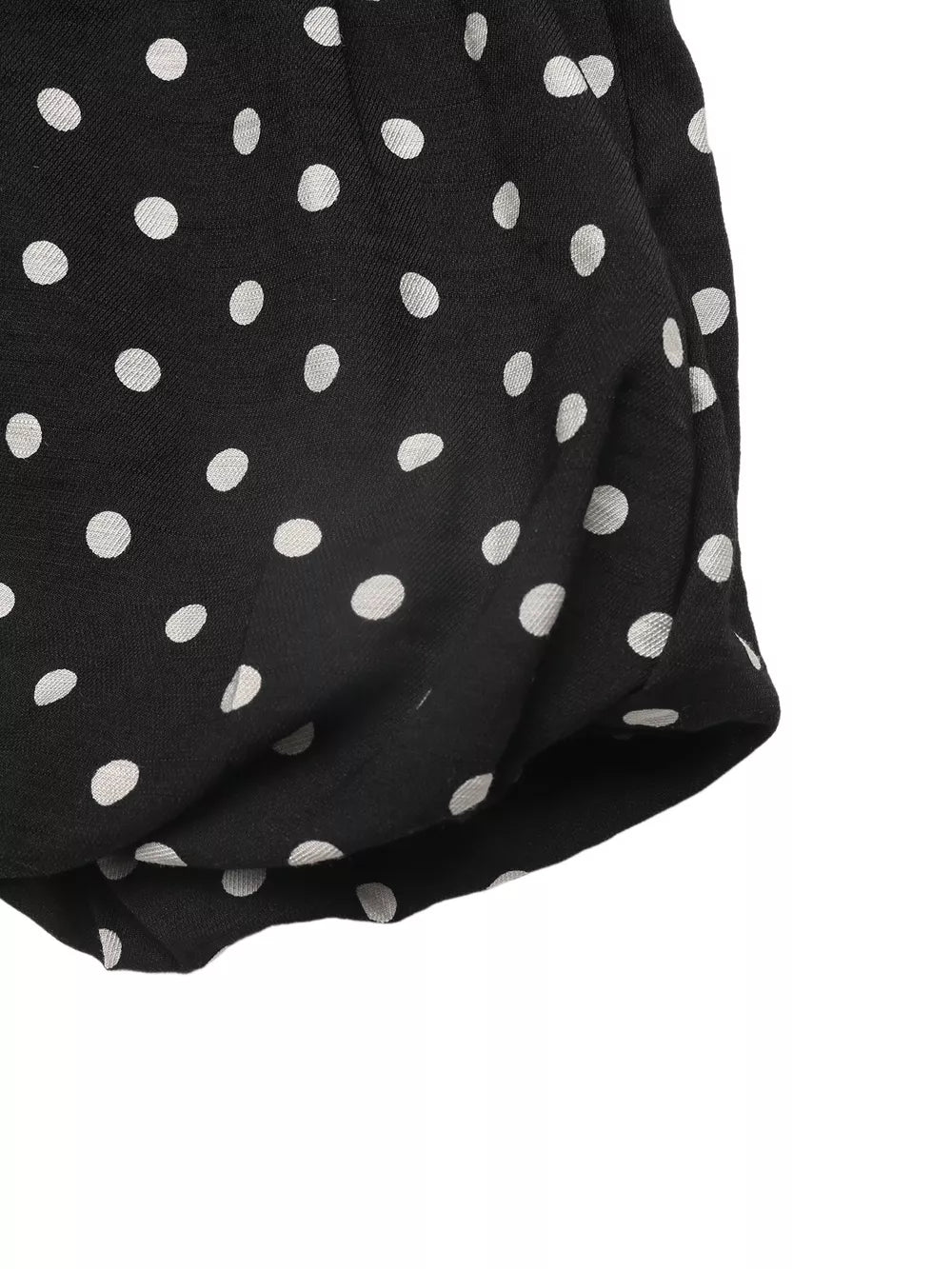 Black polka dot dress with ruffled hem detail