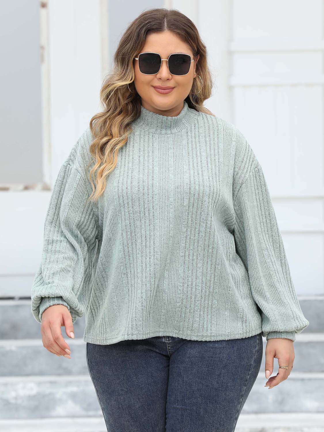Textured balloon sleeve mock neck sweater in Gum Leaf, with ribbed knit and relaxed fit.
