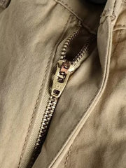 Khaki cargo pants with a YKK zipper detail