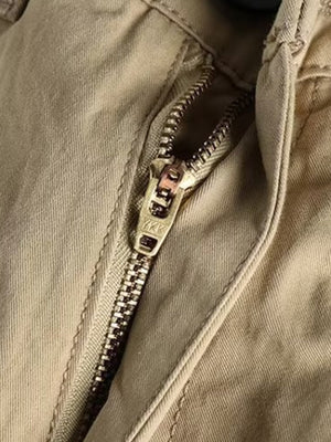 Khaki cargo pants with a YKK zipper detail
