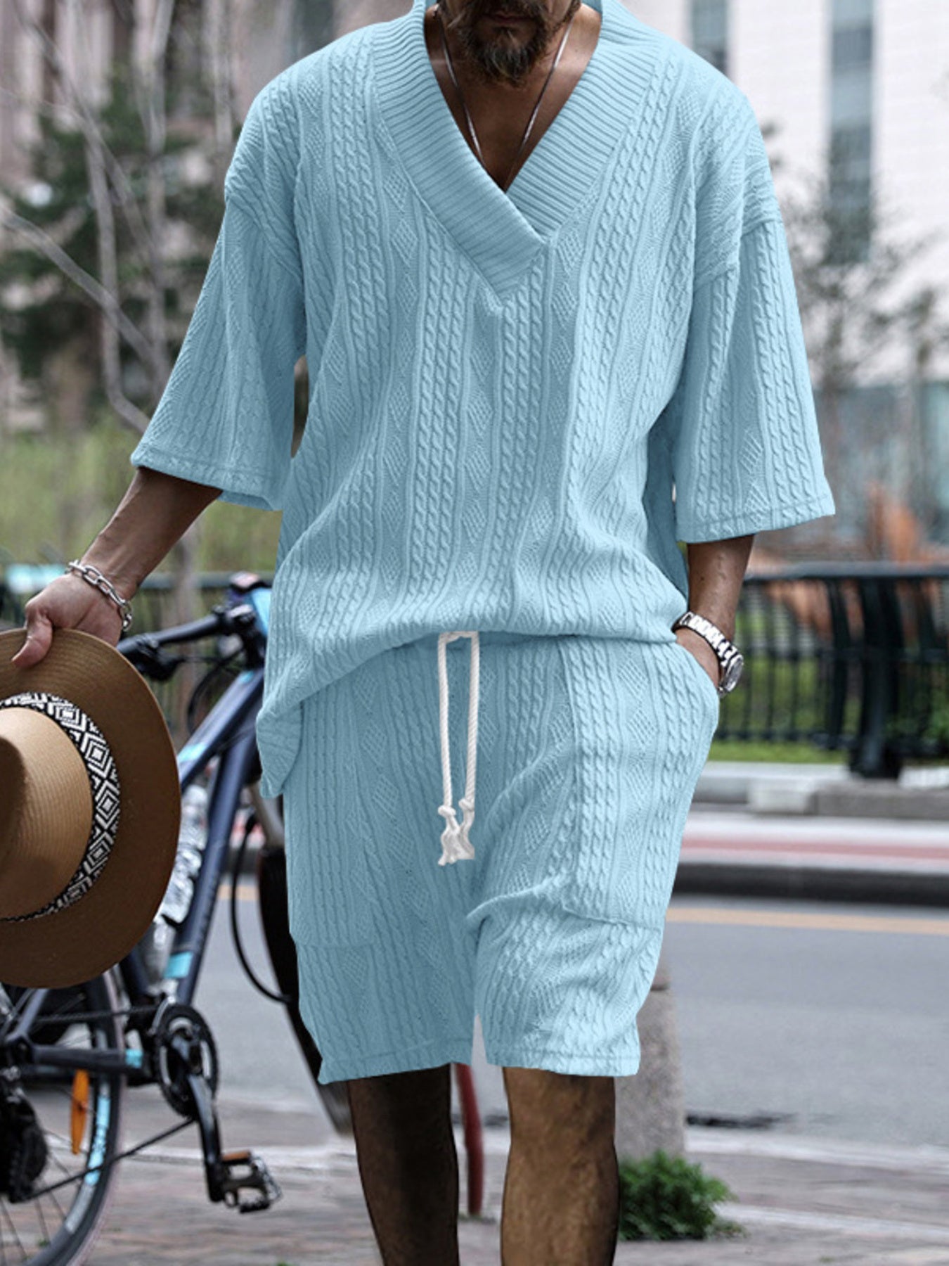 Sky blue cable-knit v-neck two-piece set with drawstring shorts and short sleeves.