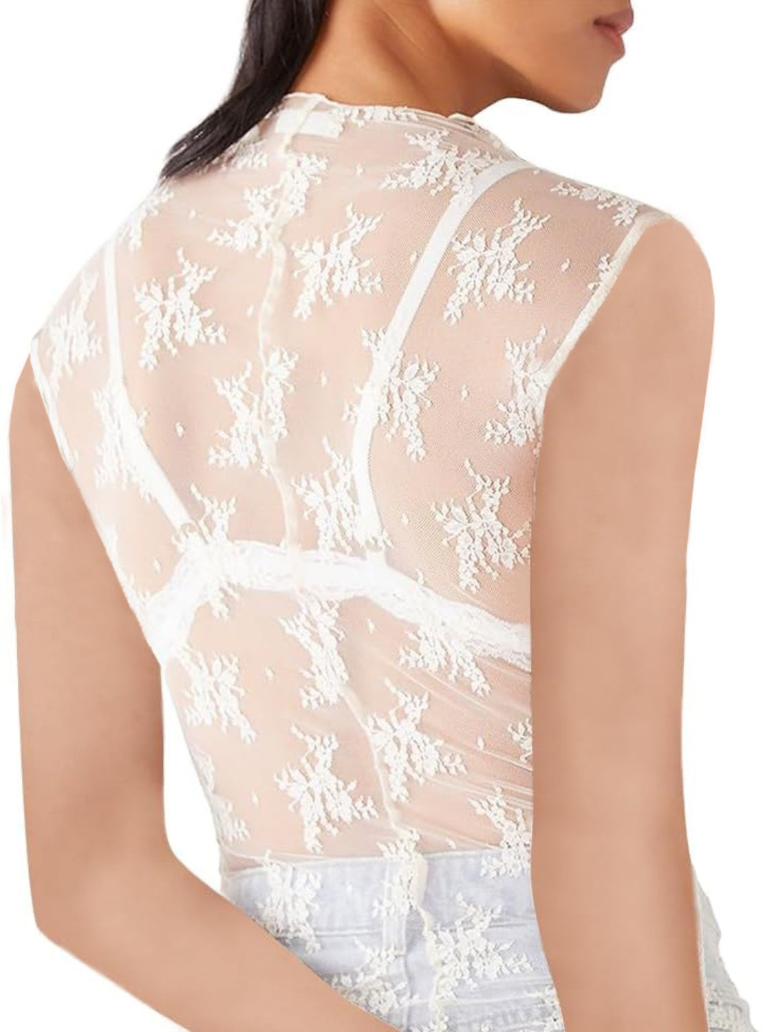 White sheer mock neck lace tank top with floral pattern and bra straps visible.