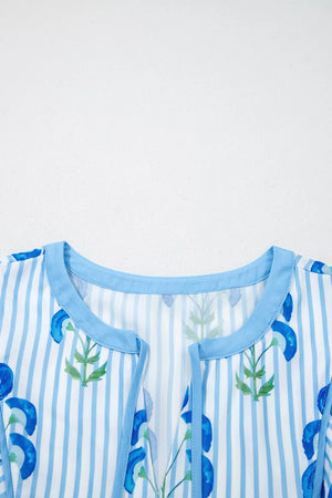 Floral stripe mini dress with blue floral print, round neck, and puff sleeves.
