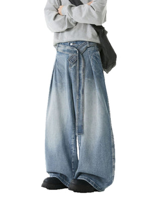 Belted relaxed fit men's jeans in light blue denim with a wide leg and tie waist.