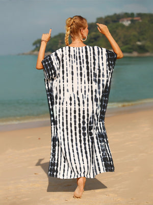Black and white tie-dye maxi kaftan dress with vertical stripes, loose fit, and short sleeves.